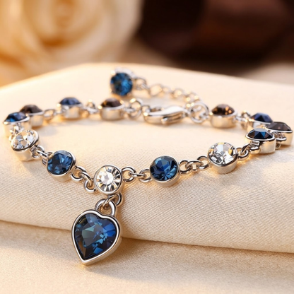 Zilverkleurige Schakelarmband Met Saffier Hart