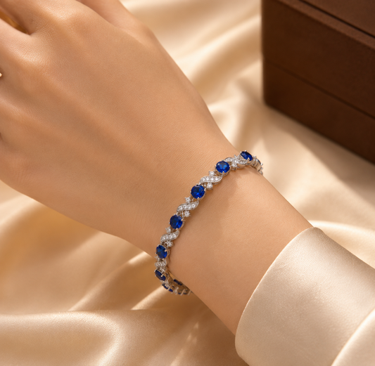 Zilverkleurige Schakelarmband Met Bloem En Saffier